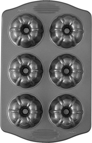 Wilton 191002522 20-Compartment Non-Stick Steel Mini Fluted Bundt Cake Pan  - 3 1/2 x 1 3/8 Cavities